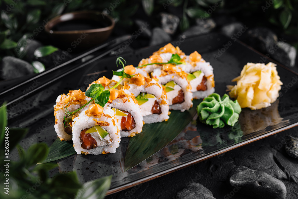 Gourmet sushi rolls with fresh toppings on elegant plate Gourmet sushi rolls with fresh toppings on elegant plate