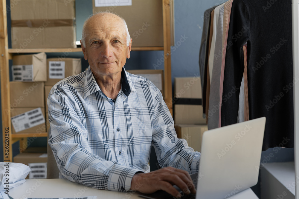 An elderly owner of an online store communicates with client about delivery of clothes. Startup start An elderly owner of an online store communicates with client about delivery of clothes. Startup start
