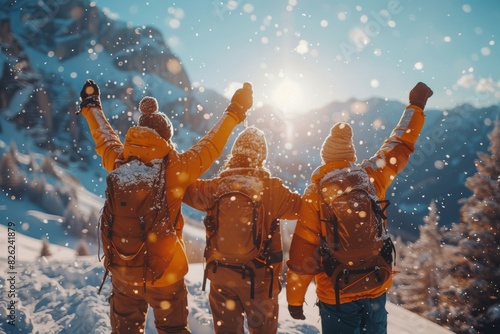 Three individuals with arms raised are celebrating together in a snowy landscape with a forest backdrop  conveying joy and triumph