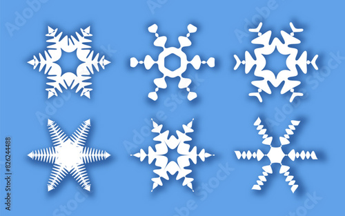 Snowflakes of different shapes on a blue background. Vector illustration