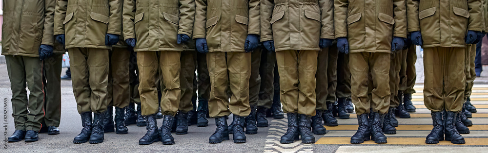 Army Soldiers In Uniform Standing In A Row On Parade Ground During Inspection Army Soldiers In Uniform Standing In A Row On Parade Ground During Inspection
