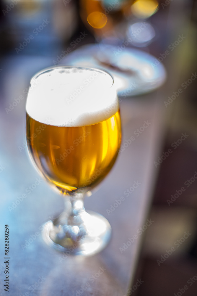 Tulip Glass of Beer on a Bar in Spain During Daytime With Vintage Lens Tulip Glass of Beer on a Bar in Spain During Daytime With Vintage Lens