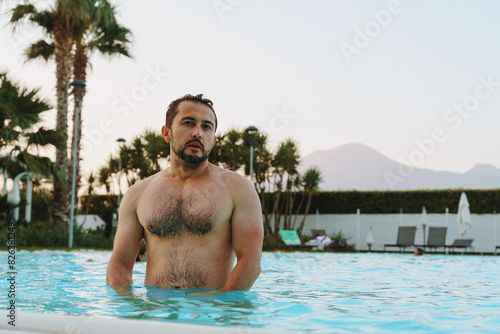 man standing in outdoor swimming pool