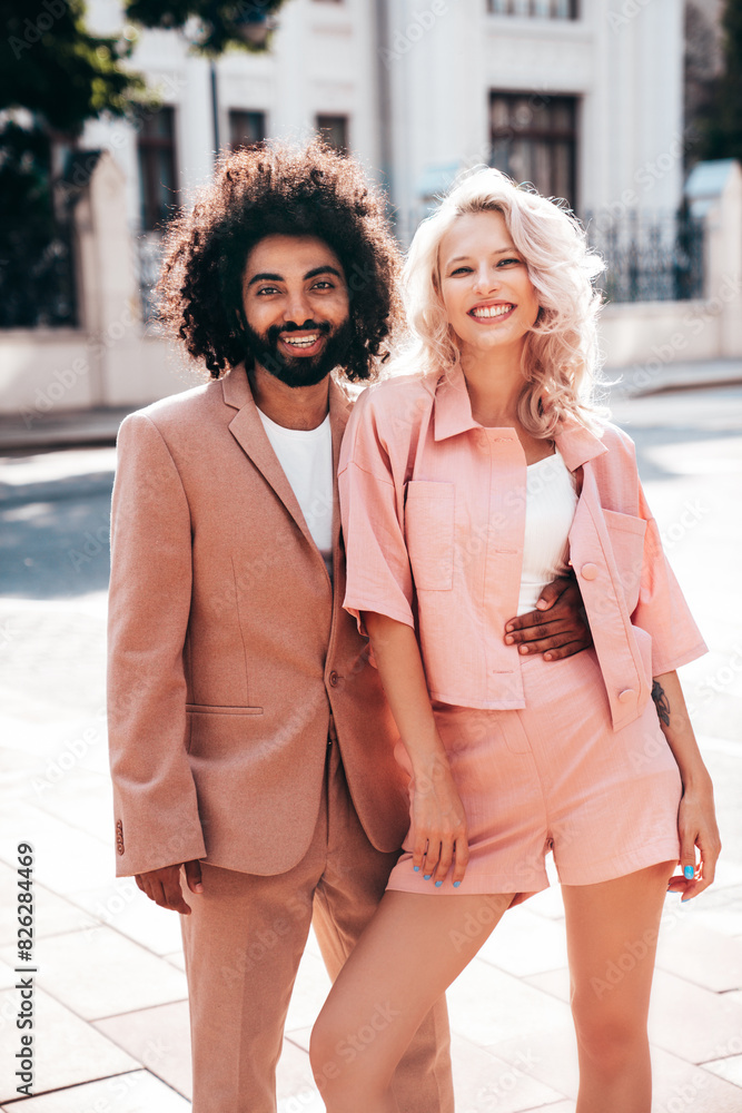 Beautiful fashion woman and her handsome elegant boyfriend in beige suit. Sexy blond model in summer suit clothes. Fashionable smiling couple posing in street Europe. Brutal man and female outdoors Beautiful fashion woman and her handsome elegant boyfriend in beige suit. Sexy blond model in summer suit clothes. Fashionable smiling couple posing in street Europe. Brutal man and female outdoors