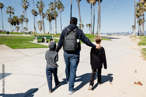 Uncle & Nephews on Boardwalk in Venice Beach, CA photo