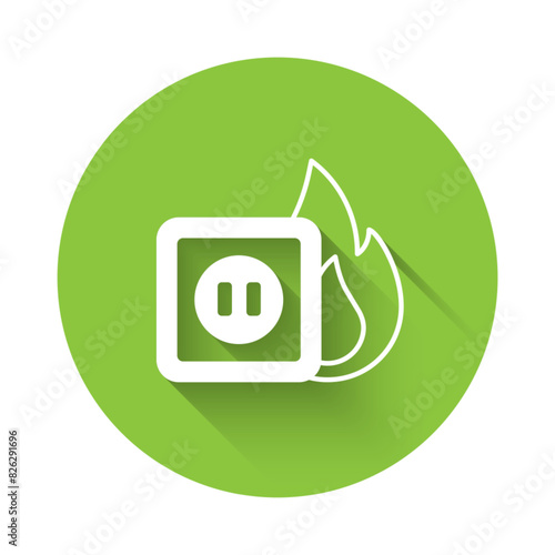 White Electric wiring of socket in fire icon isolated with long shadow background. Electrical safety concept. Plug outlet on fire. Green circle button. Vector