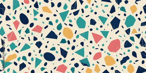 Colorful terrazzo pattern featuring irregularly shaped and differently sized fragments in shades of blue, green, orange, and pink scattered on a beige background.