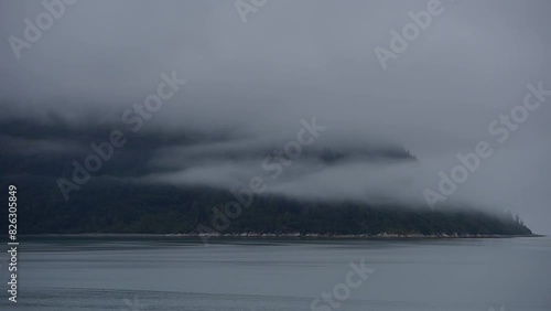 Scenic view of the Glacier Bay Basin on a foggy cloudy morning in southeastern Alaska, United States photo