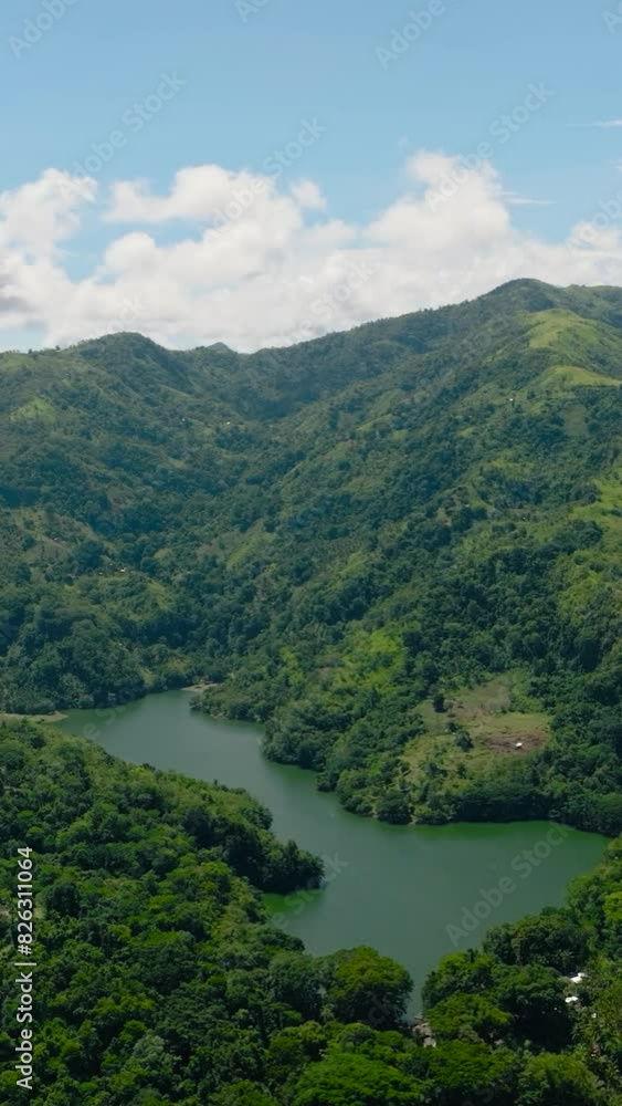 Lake among mountains with tropical forest. Lake Balanan. Negros, Philippines Lake among mountains with tropical forest. Lake Balanan. Negros, Philippines