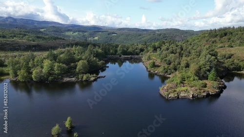 Zoom out drone shot of Snowdonia National Park revealing Llyn Elsi lake. photo
