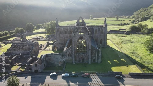 Drone shot of the ruins of Tintern Abbey (Abaty Tyndryn) in Tintern village, Monmouthshire, Wales photo