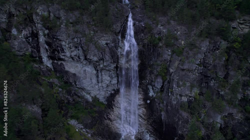 Ascending drone shot of Stodnafossen waterfall on a cloudy foggy day in Laerdalsoyri, Norway Ascending drone shot of Stodnafossen waterfall on a cloudy foggy day in Laerdalsoyri, Norway