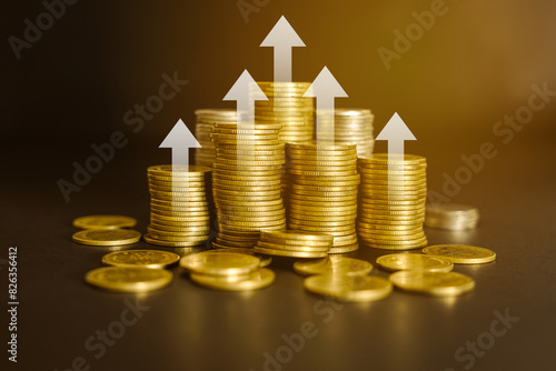 white up arrow with stacks of golden money coins. financial growth or investment success concept. 