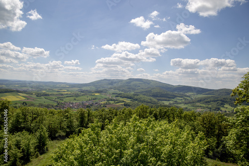 Mountain landscape in Germany near Bad-Sooden-Allendorf. View of Messner Kress in the background on a beautiful sunny day with blue sky and clouds in springtime