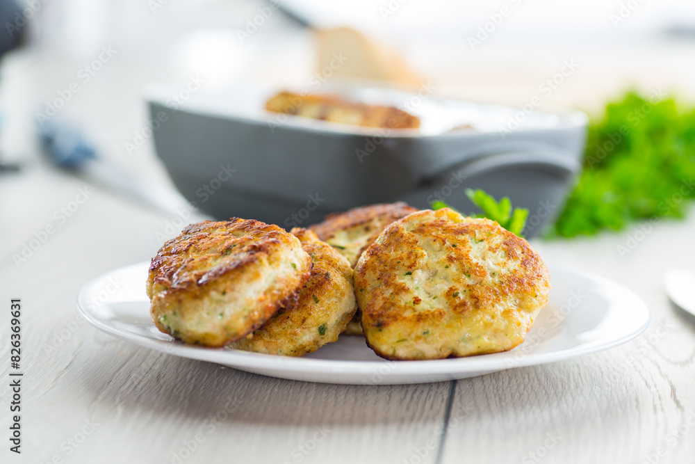 fried meat cutlets in a ceramic form on a wooden table fried meat cutlets in a ceramic form on a wooden table