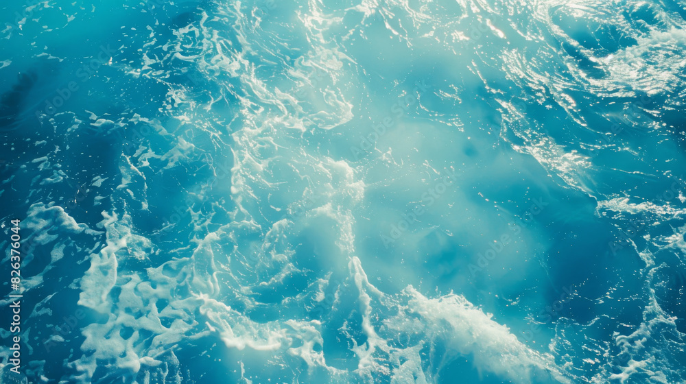 Fototapeta premium Top view of blue sea surface background