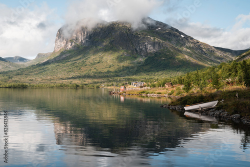 Lake Gjende with the Gjendebu Lodge by the Shore in Summer photo