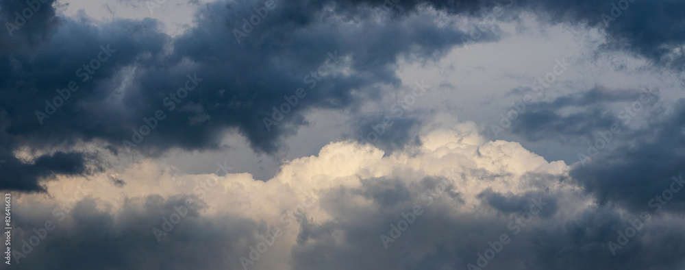 A threatening stormy sky with dark and light clouds A threatening stormy sky with dark and light clouds