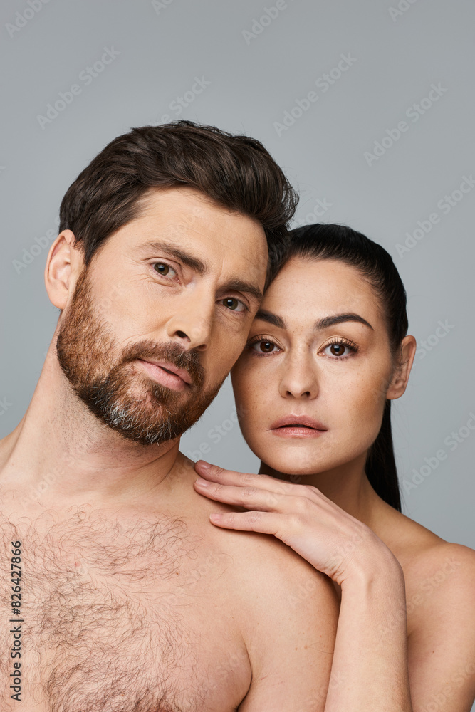 Fototapeta premium A man and a woman, showcasing their magnetic beauty while posing for a picture.