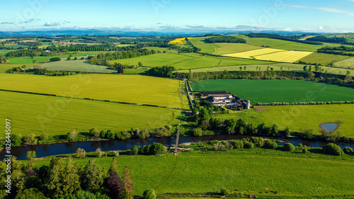 Aerial view of green farmland along River Annan, Lockerbie, Scotland, United Kingdom. photo