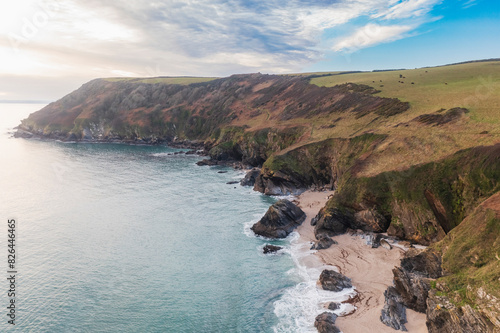 Aerial view of rugged coastline and sandy beach at Lantic Bay, Fowey, England, United Kingdom. photo