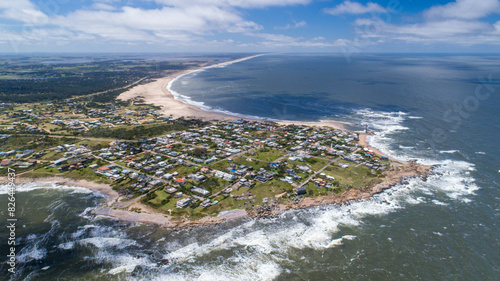 Aerial view of sandy beach and blue ocean waves, Jose Ignacio, Maldonado, Uruguay. photo