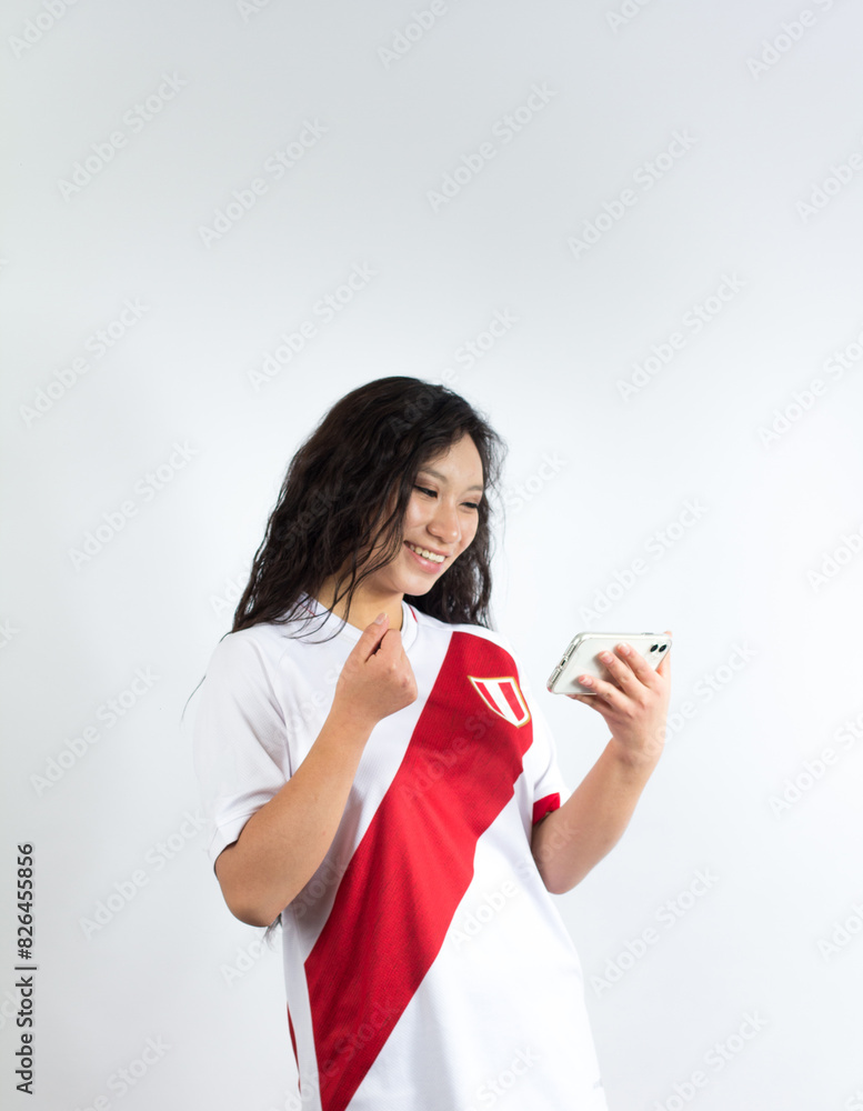 Photograph of a woman Peruvian sports fan celebrating. Photograph of a woman Peruvian sports fan celebrating.