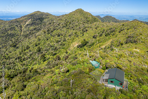 Aerial view of natural forest landscape with mountain summit in Te Pahu, Waikato, New Zealand. photo