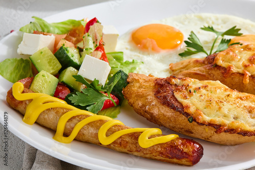 Delicious Combo Breakfast with Fried Egg, Cheese Toast, Sausage, and Vegetable Salad