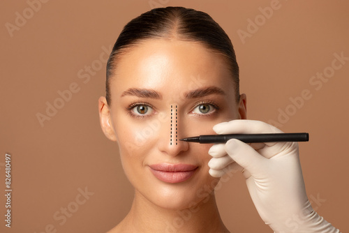 Obraz na płótnie Young European woman preparing for cosmetic surgery, rhinoplasty operation, doct