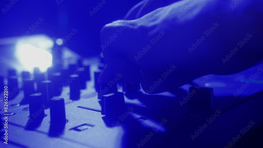 DJ playing music on festival in night club. Techno musician with headphones and sunglasses performing at nightclub for concert crowd of people, city bar. DJ playing music on festival in night club. Techno musician with headphones and sunglasses performing at nightclub for concert crowd of people, city bar.