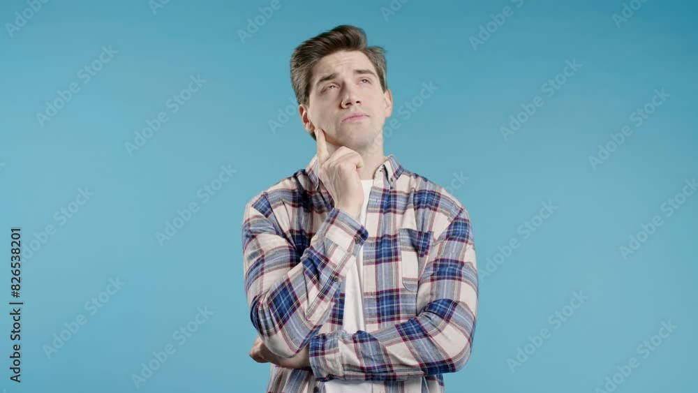 Thinking around man on blue background. Smart student 30s guy finding answer Thinking around man on blue background. Smart student 30s guy finding answer