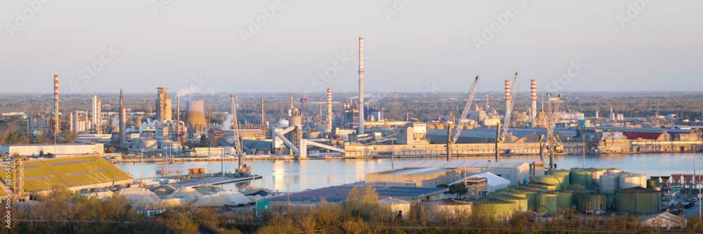 Aerial view of the industrial and port area of Ravenna ,chemical and petrochemical pole,thermoelectric,metallurgical plants and hydrocarbon refinery and liquefied natural gas tanks Aerial view of the industrial and port area of Ravenna ,chemical and petrochemical pole,thermoelectric,metallurgical plants and hydrocarbon refinery and liquefied natural gas tanks