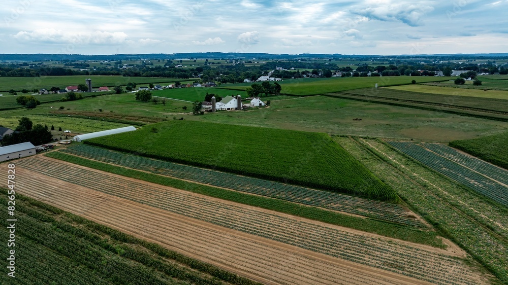 An Aerial View of Farmland with Barns and Silos in Rural Countryside