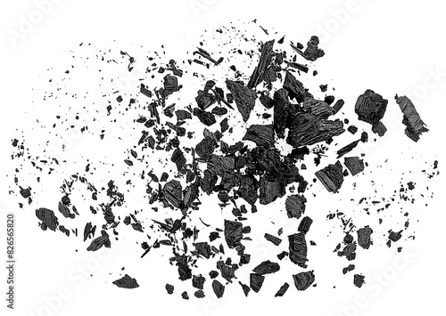 Black charcoal particles on a white background  top view. Charcoal dust.