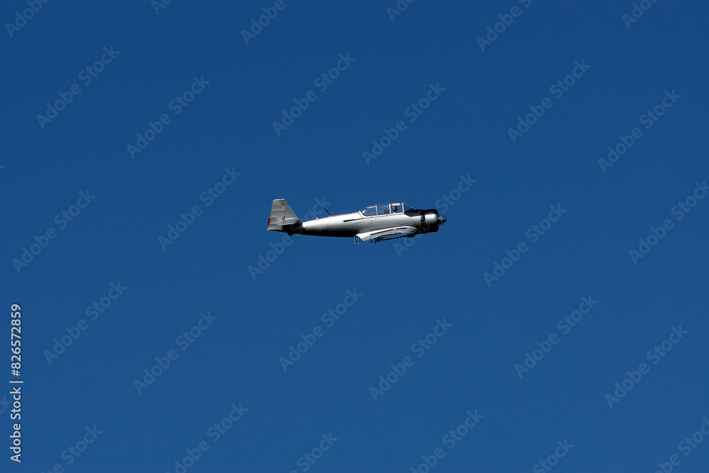 An old plane against the blue sky.