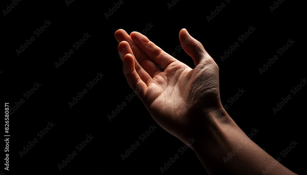 hand reaching upwards on dark background, palm open, evoking curiosity and a sense of seeking. hand reaching upwards on dark background, palm open, evoking curiosity and a sense of seeking.