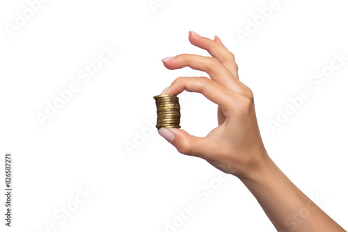 A woman's hand holds a stack of golden coins between her fingers, isolated on a white background. Concept of saving, accumulation, money financing. Material goods. Business. Economy