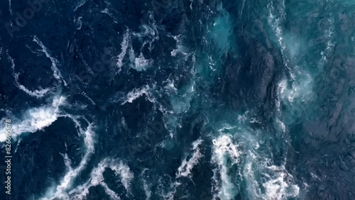 Aerial view to ocean waves. Blue water background