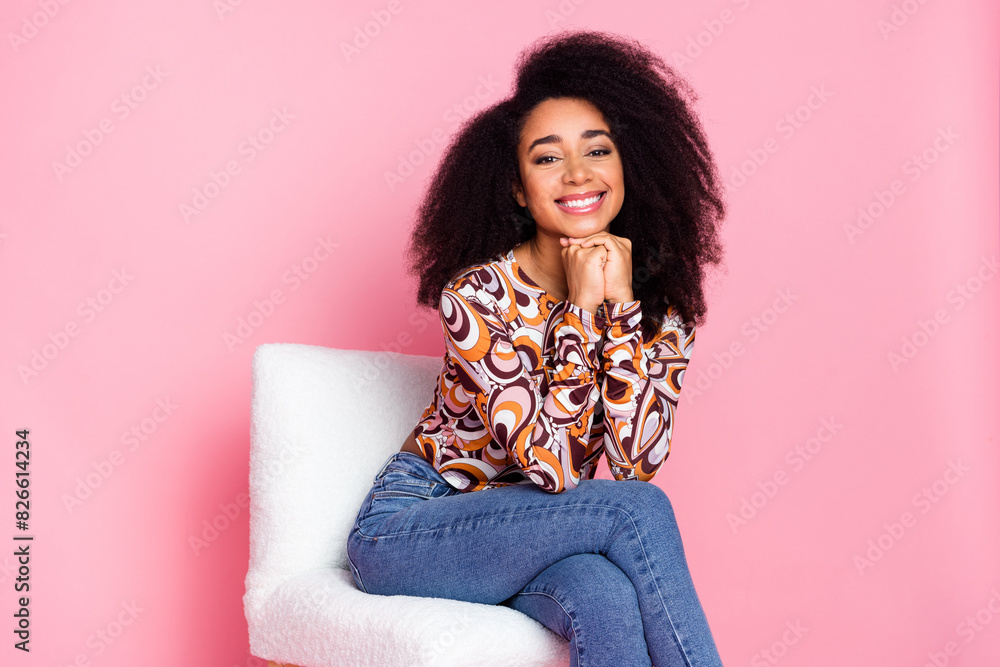 Photo of adorable lovely girl wear print shirt sitting stool smiling empty space isolated pink color background Photo of adorable lovely girl wear print shirt sitting stool smiling empty space isolated pink color background