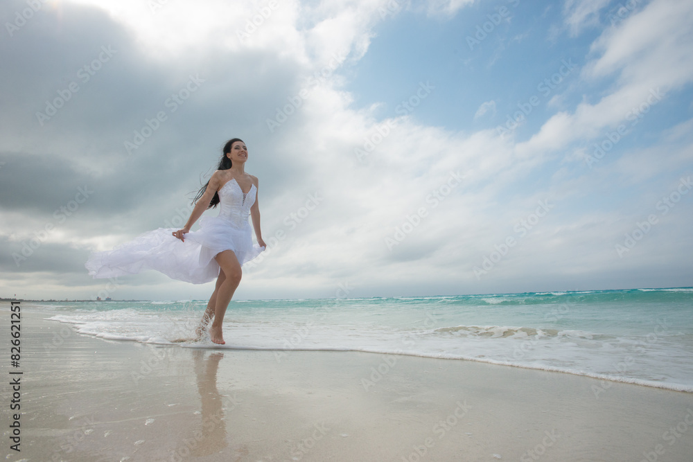 woman in a white dress runs along the beach, runaway bride, brunette in a white dress, girl running woman in a white dress runs along the beach, runaway bride, brunette in a white dress, girl running