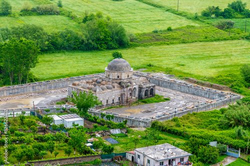 A view of a mosque at the foot of Rozafa castle above Shkoder in Albania in summertime photo