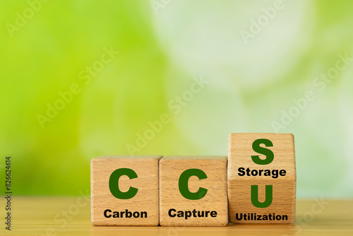 Obraz na płótnie Wooden cubes form the symbol CCU (carbon capture utilization) and CCS (carbon capture storage). Environmental Business concept, Net zero action, Save energy, green energy, reduce carbon footprint w salonie