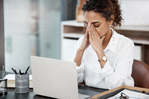 Business, woman and stress with laptop in office for project deadline, pressure and expectation with burnout of overworked. Girl, headache and migraine with fatigue, exhausted and tired of work.