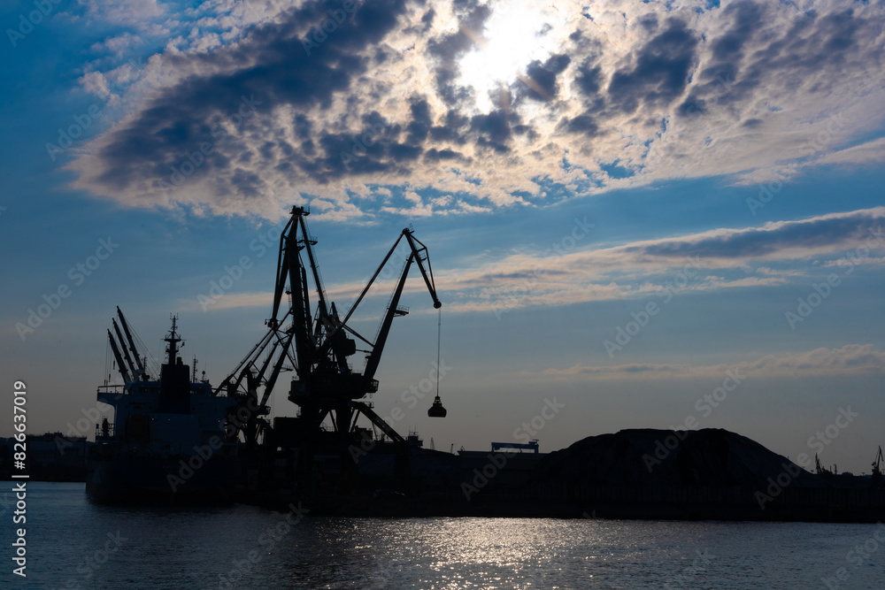 Fototapeta premium Gdynia port at sunset time, silhouettes and sea, Poland