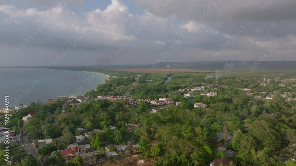 Discover Jamaica's stunning green landscapes and tranquil coastlines from a bird's eye view. Experience paradise with this panoramic perspective Discover Jamaica's stunning green landscapes and tranquil coastlines from a bird's eye view. Experience paradise with this panoramic perspective