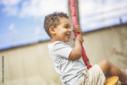 Happy kid on playground on summer season