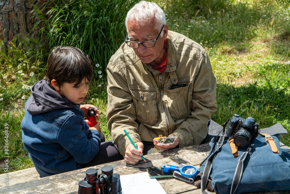 Grandfather and grandson enjoying outdoor spring activity