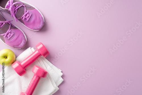 Flat lay of fitness equipment including pink sneakers, dumbbells, towel, and apple on a pastel purple background
