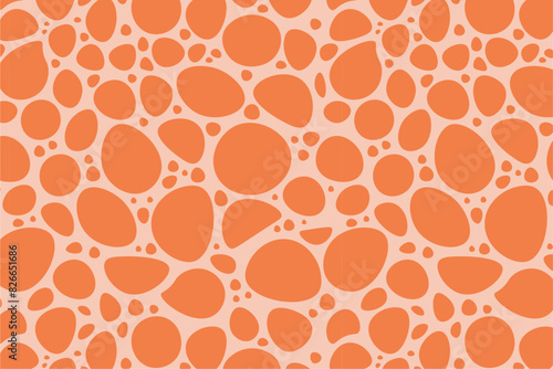 Seamless pattern of orange slobs on a light red background. Organic shapes vector design for textiles, wallpapers, and prints.  photo
